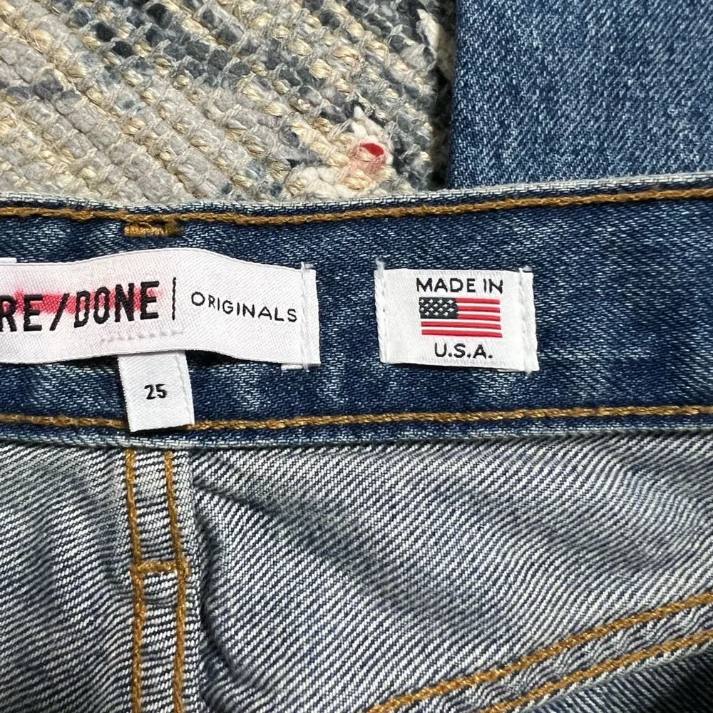Re Done high rise stove pipe raw frayed hem denim jeans